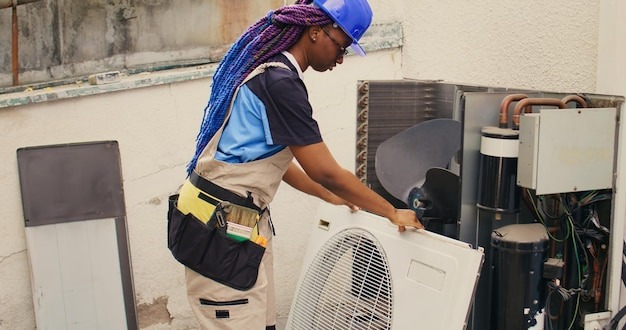 A Professional Working For AC Repair