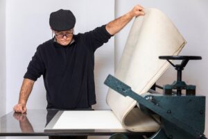 The close-up of a person making bulk T-shirt printing in the UK