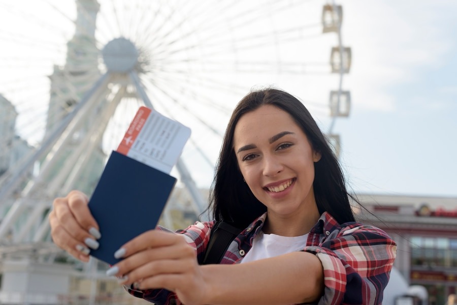 a happy lady with her american tourist visa